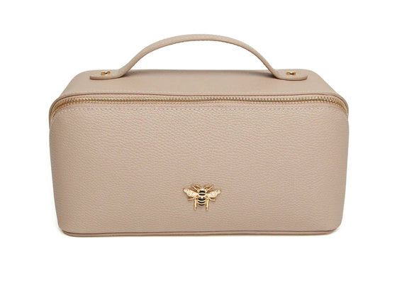 Keep all your beauty essentials in order with this Stone luxurious mini makeup bag. With gold trimmings and a beautiful gold Bee, this bag opens wide to reveal two compartments with a little inner pocket.

W18cmx H9.5cm x D9.5cm
