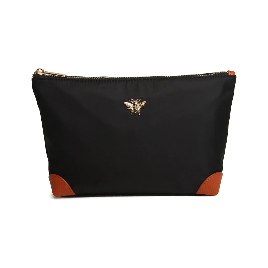 black cosmetic bag with leather corners and a gold bee