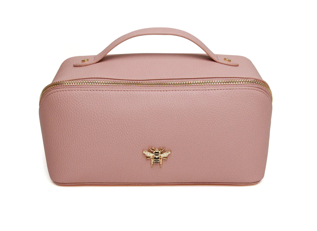 pink leather makeup bag with gold trimmings, a handle, two compartments inside and a gold bee on the front