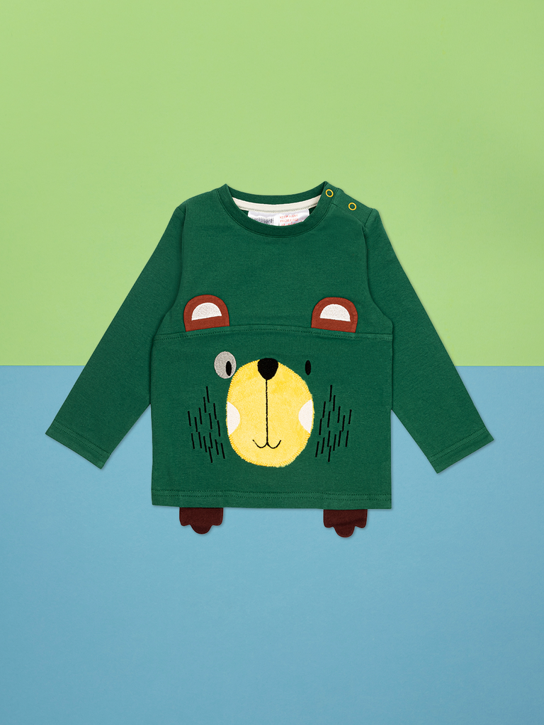 dgreen long sleeved top with a yellow bear face and brown ears and little brown feet sticking out under the front hem 