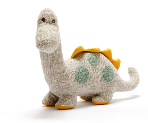 large grey knitted diplodocus with teal spots and mustard spikes and feet