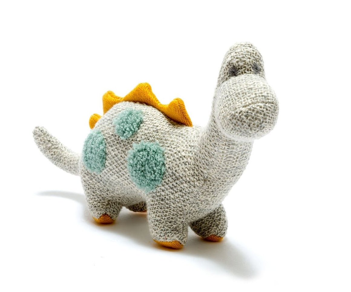 grey knitted diplodocus with teal spots and mustard spikes and feet