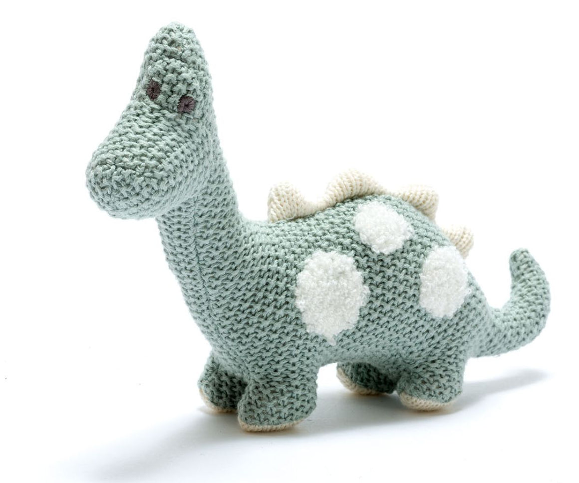 teal knitted diplodocus with white spots and spikes