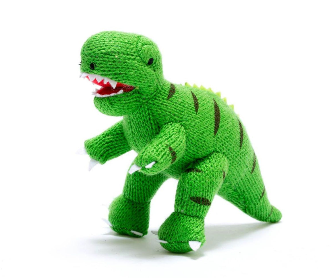 green knitted t rex standing roaring with a wide open red mouth and white sharp teethn gentle rattle sound when shaken