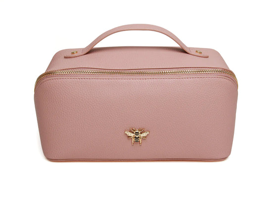 Keep all your beauty essentials in order with this Pale Pink luxurious mini makeup bag. With gold trimmings and a beautiful gold Bee, this bag opens wide to reveal two compartments with a little inner pocket.

W18cmx H9.5cm x D9.5cm