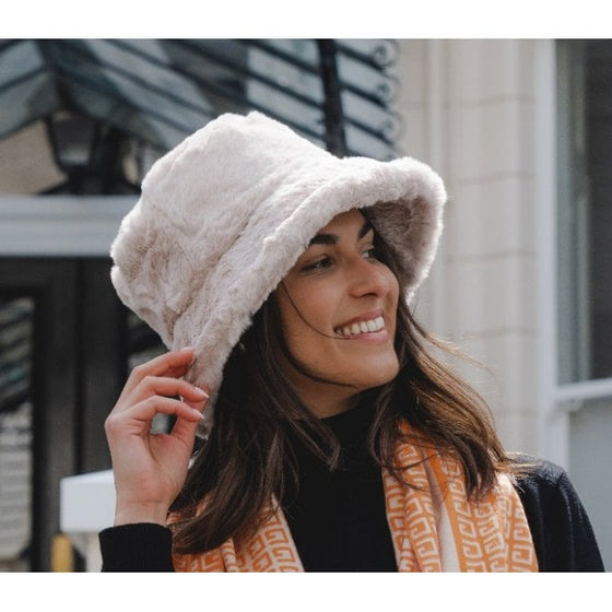 A beautiful stone faux fur hat with wide brim. Gorgeous for those chilly winter days.

100% Polyester