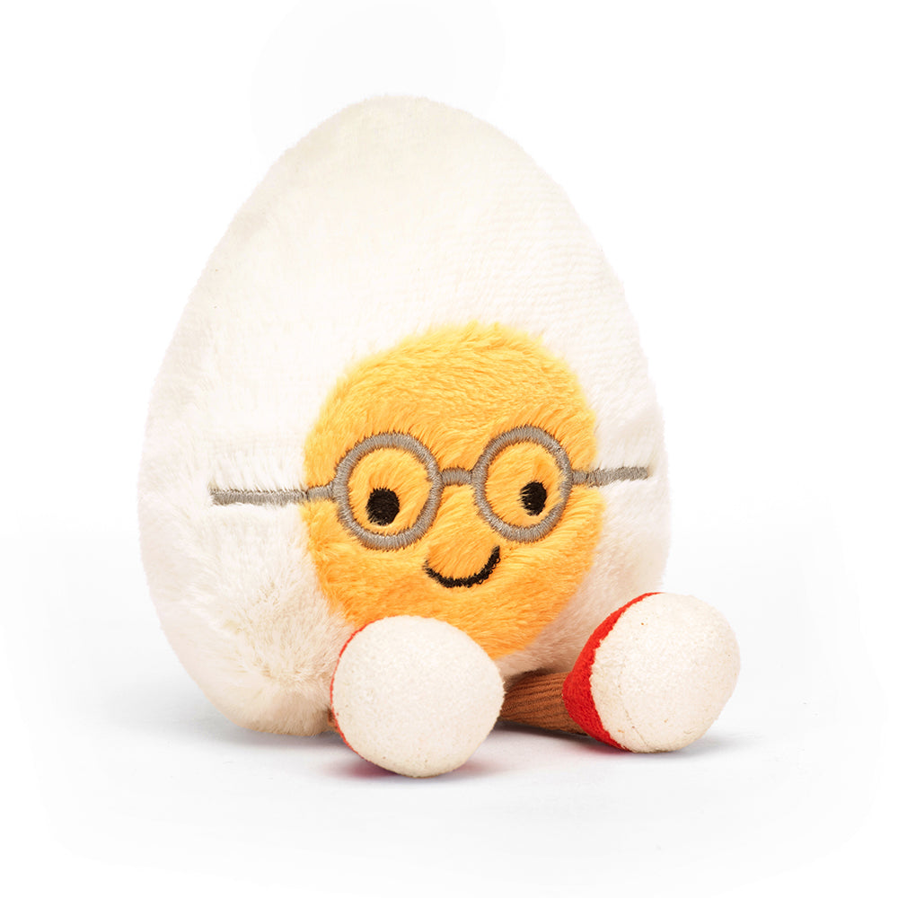 A highly Amusable Geeky Egg. With glasses and red trainers on those little chocolate cord legs.  Perfect as a little study buddy.

