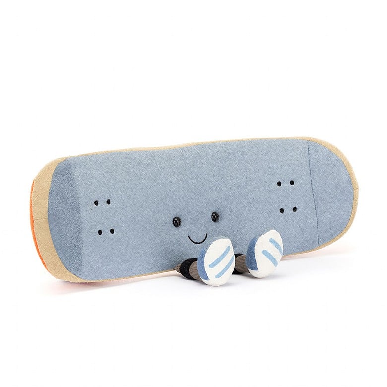 light blue skateboard, sat down with feet sticking out and smiling, with an orange base.