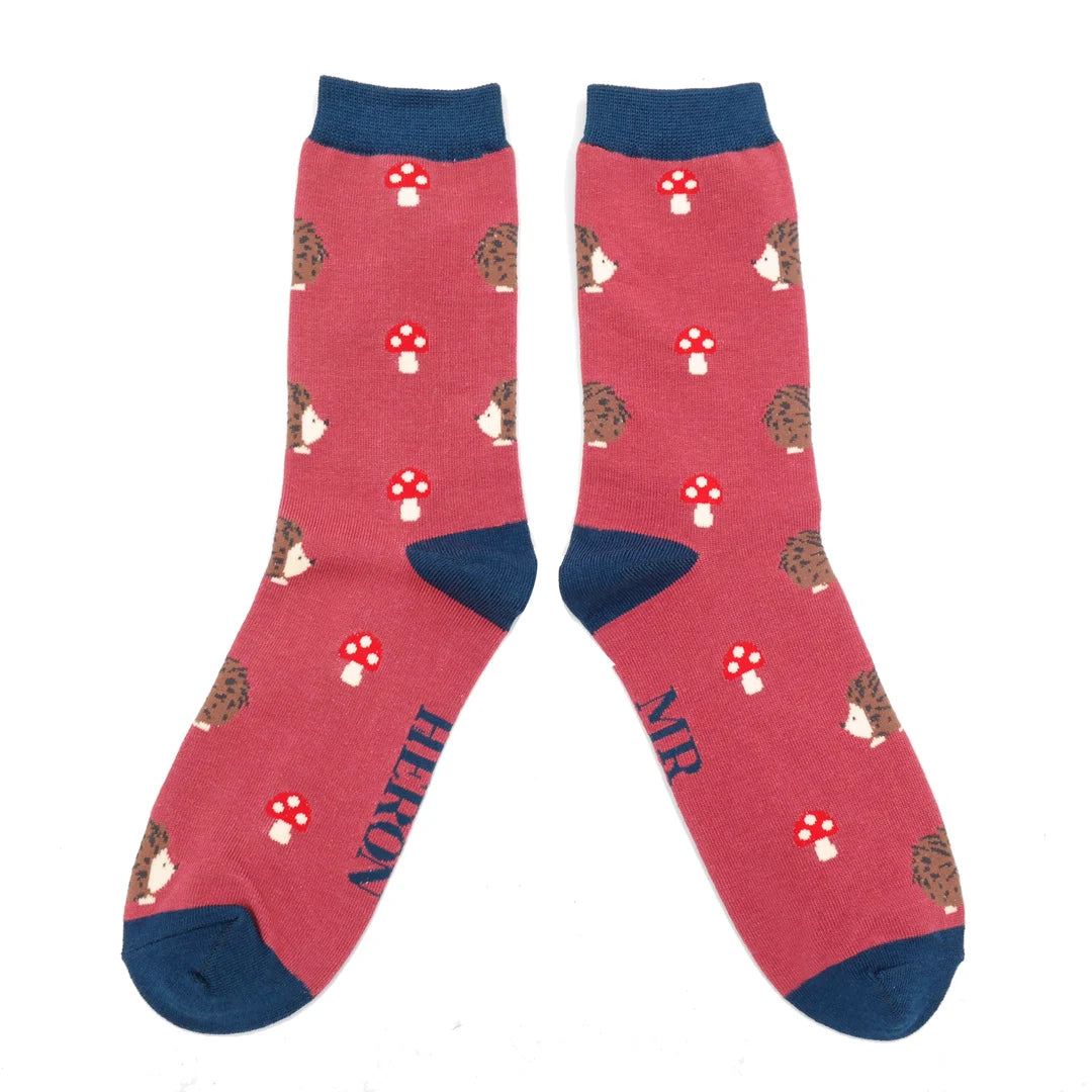 Red ankle socks with a navy trim nd a pattern of hedgehogs and red and white toadstools