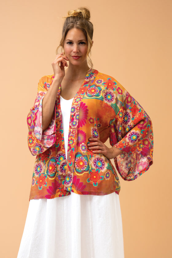 With the beautiful combination of vibrant colours and luxurious fabric, this stylish kimono jacket is perfect for adding a bit of glamour to any occasion. A stunning array of glorious orange, pink and turquoise florals with two exquisite flying crane birds on the reverse of the jacket.

One size

50% Viscose 50% Modal

Fabulous packaging included