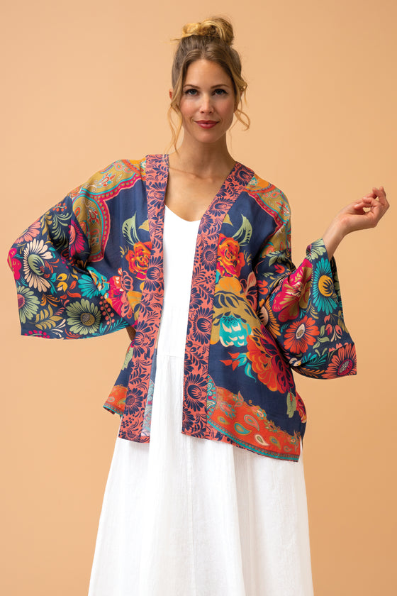 With the beautiful combination of vibrant colours and luxurious fabric, this vintage kimono jacket is perfect for adding a bit of glamour to any occasion. Blues and burnt orange colours complimented with turquoise and pink and green florals.

One size

50% Viscose 50% Modal

Fabulous packaging included


