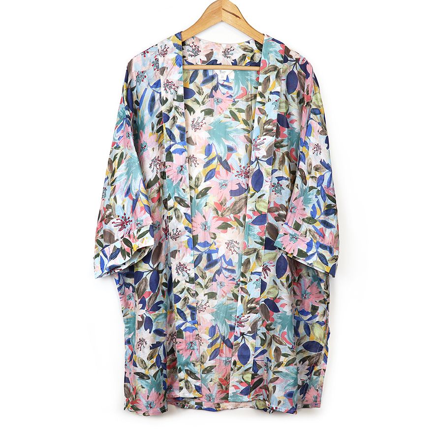 Pom longer length Kimono has a floral garden print with a mix of pink and blues.