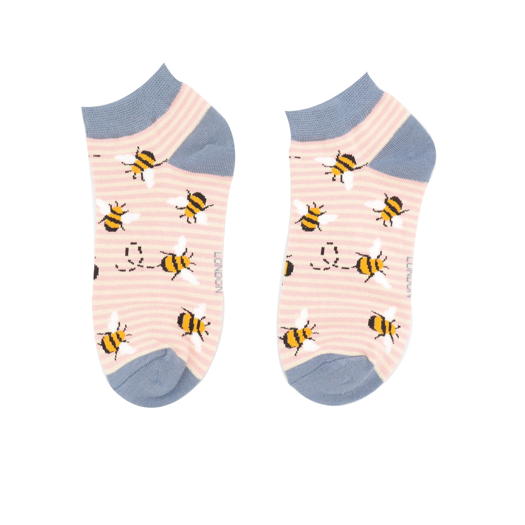 trainer socks with a pink and cream stripy background with flying bees  and denim blue toes, ankle cuffs and heels