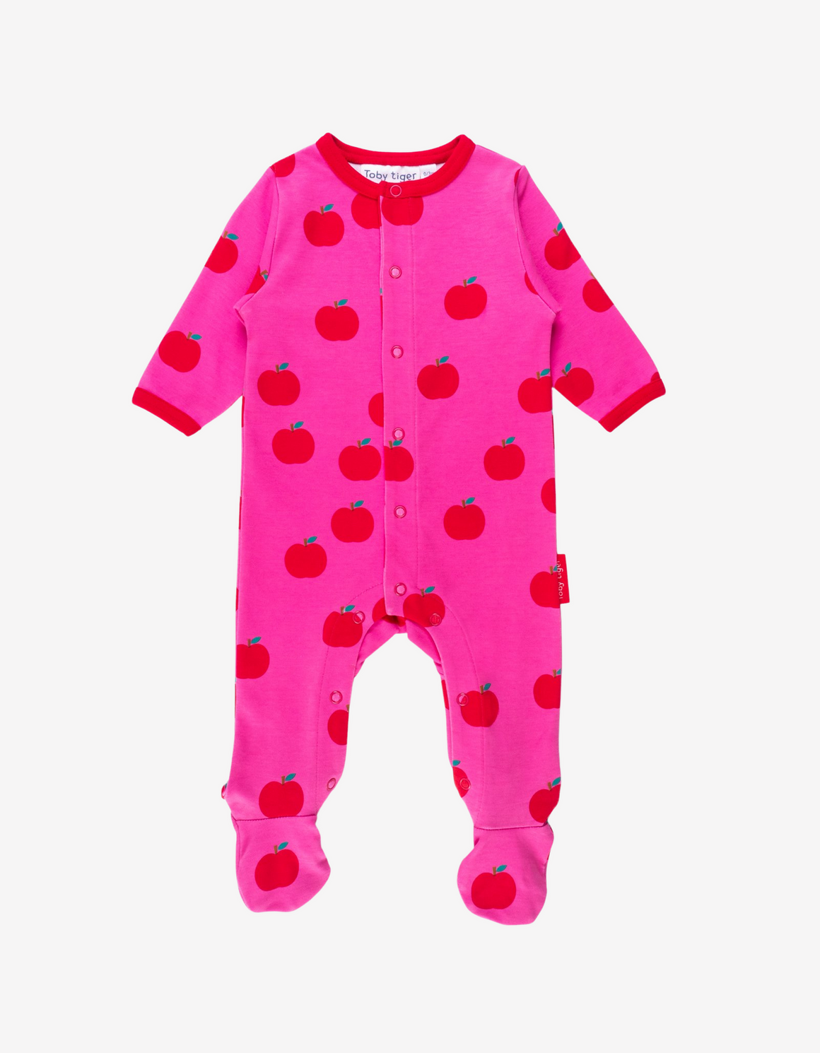 bright pink baby grow with a red apple print and red neckline and sleeves
