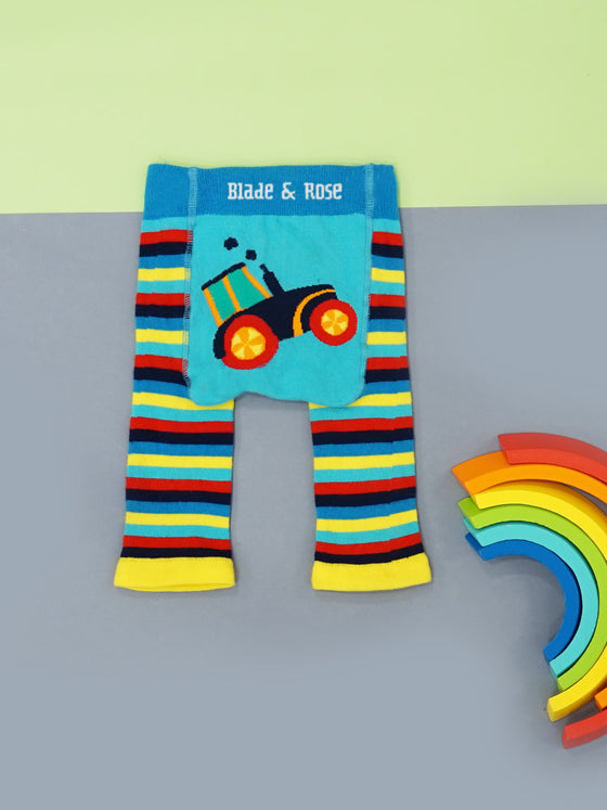 yellow, red, black, red and blue striped leggings with a colorful tractor on the bum and a bright blue blade and rose waistband