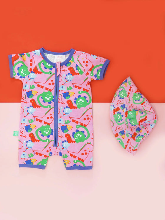 Blade and Rose Bright Dino Zip Up Romper which is bright pink and features an all over dino print, finished with a vibrant purple hem