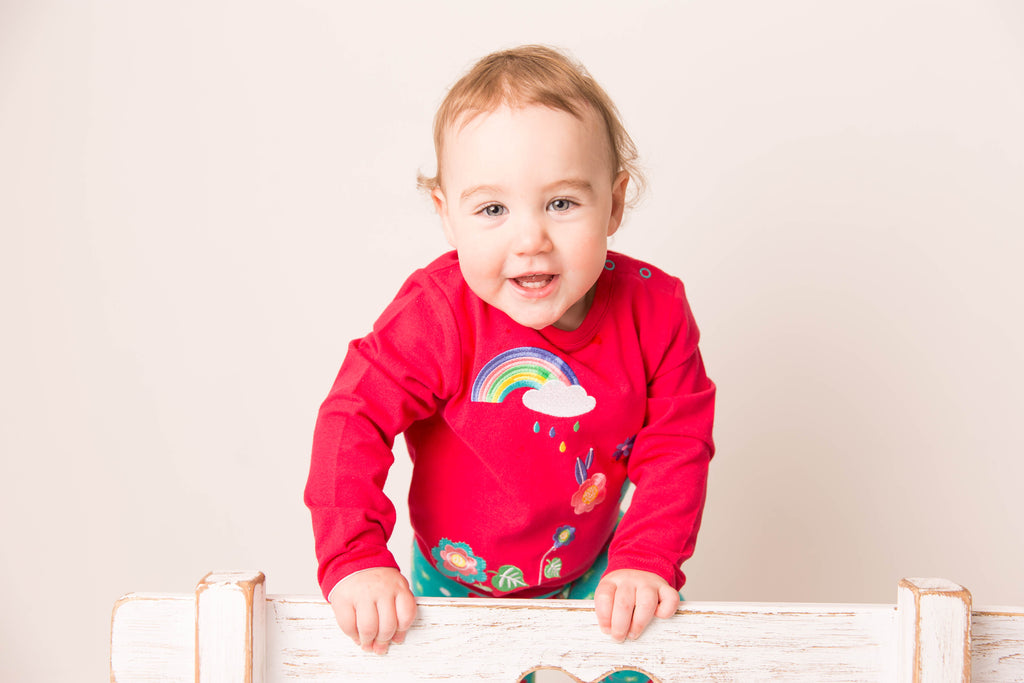 Blade and Rose Floral Garden Long Sleeve T Shirt which is A beautiful and bright with a gorgeous all over floral pattern underneath a colourful rainbow. Made from sustainable brushes cotton with poppers to make quick changes even easier. 