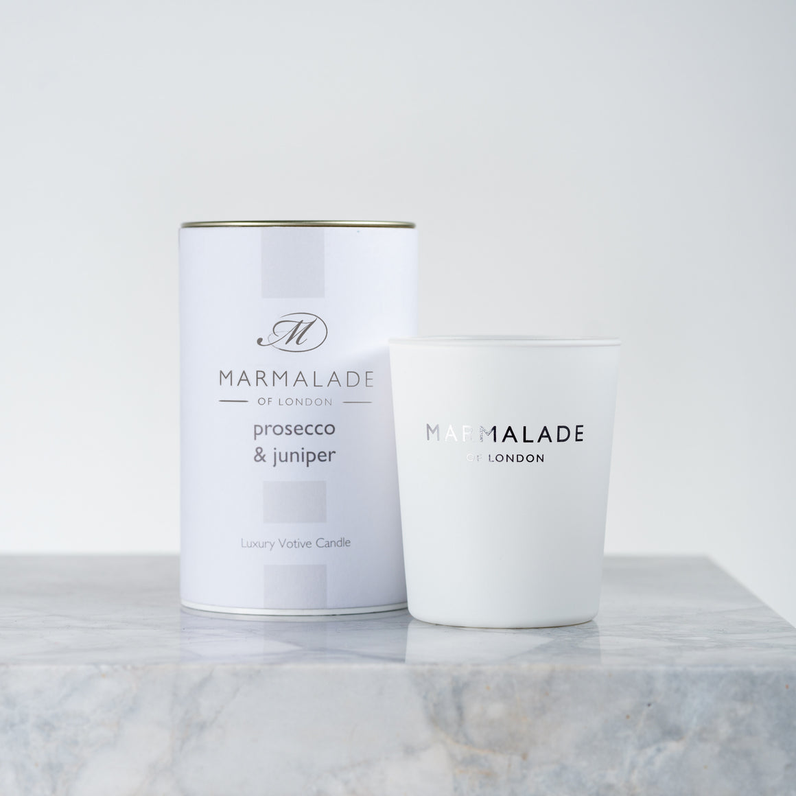 Marmalade Prosecco and Juniper Votive with white packaging