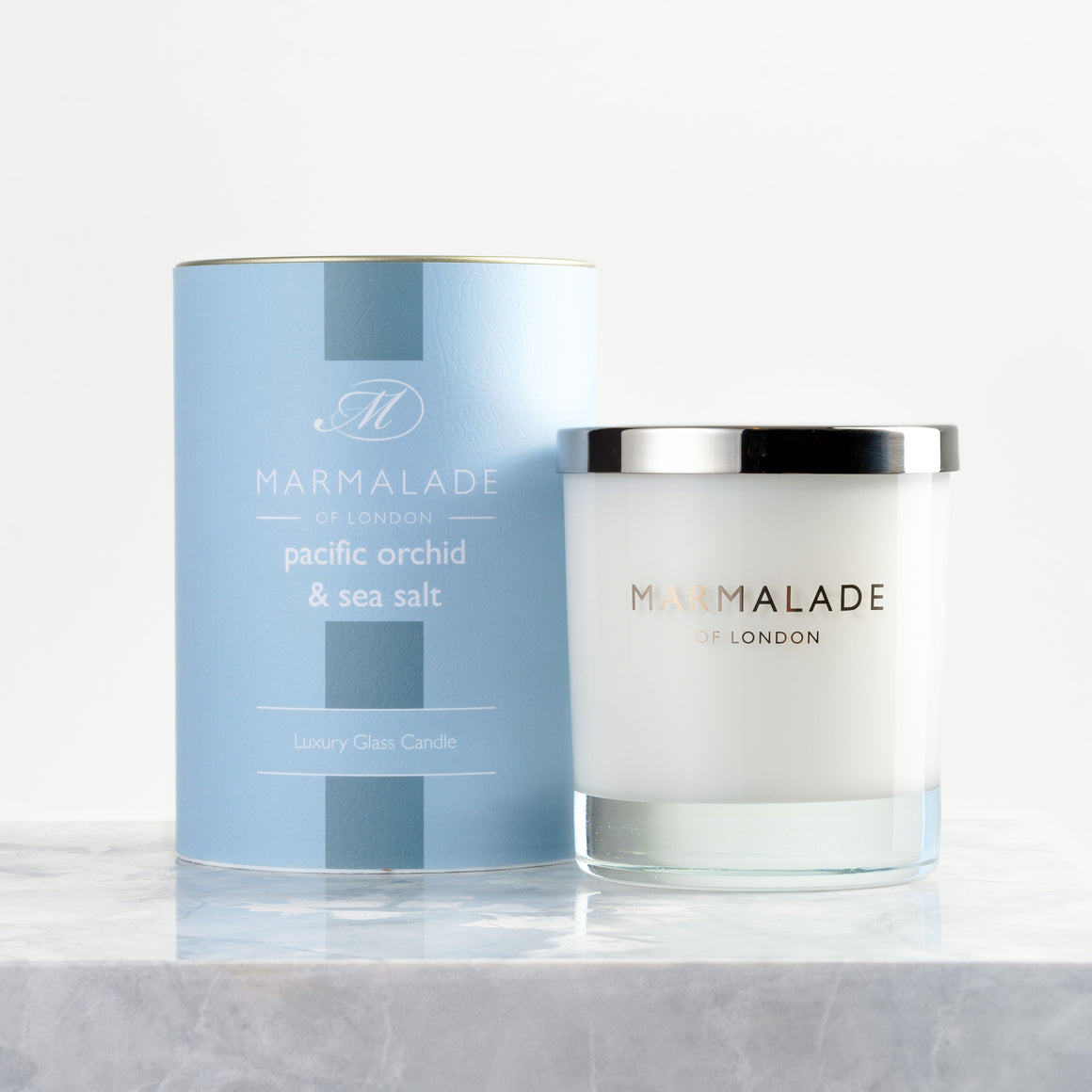 Marmalade Of London Pacific Orchid & Sea Salt Glass Candle with light blue packaging