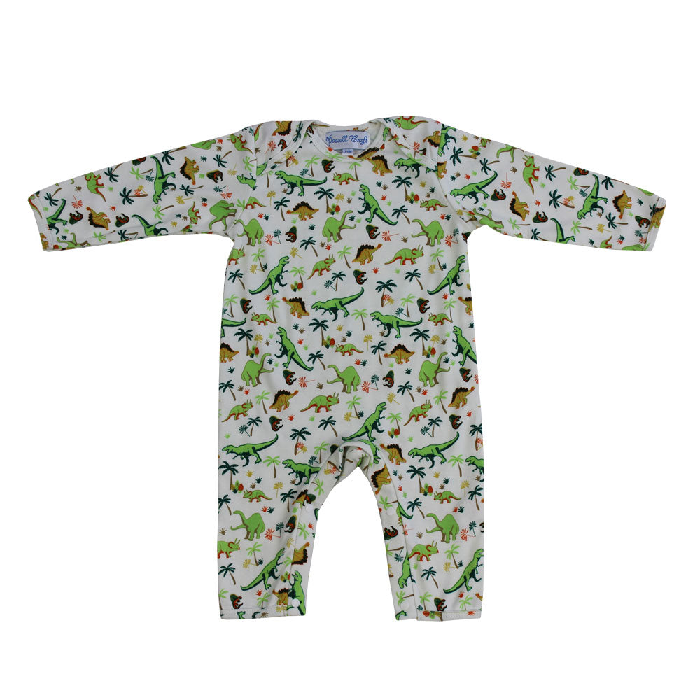 Powell Craft Dinosaur Print Baby Jumpsuit with long sleeves and legs and a dinosaur print with trees against a cream background